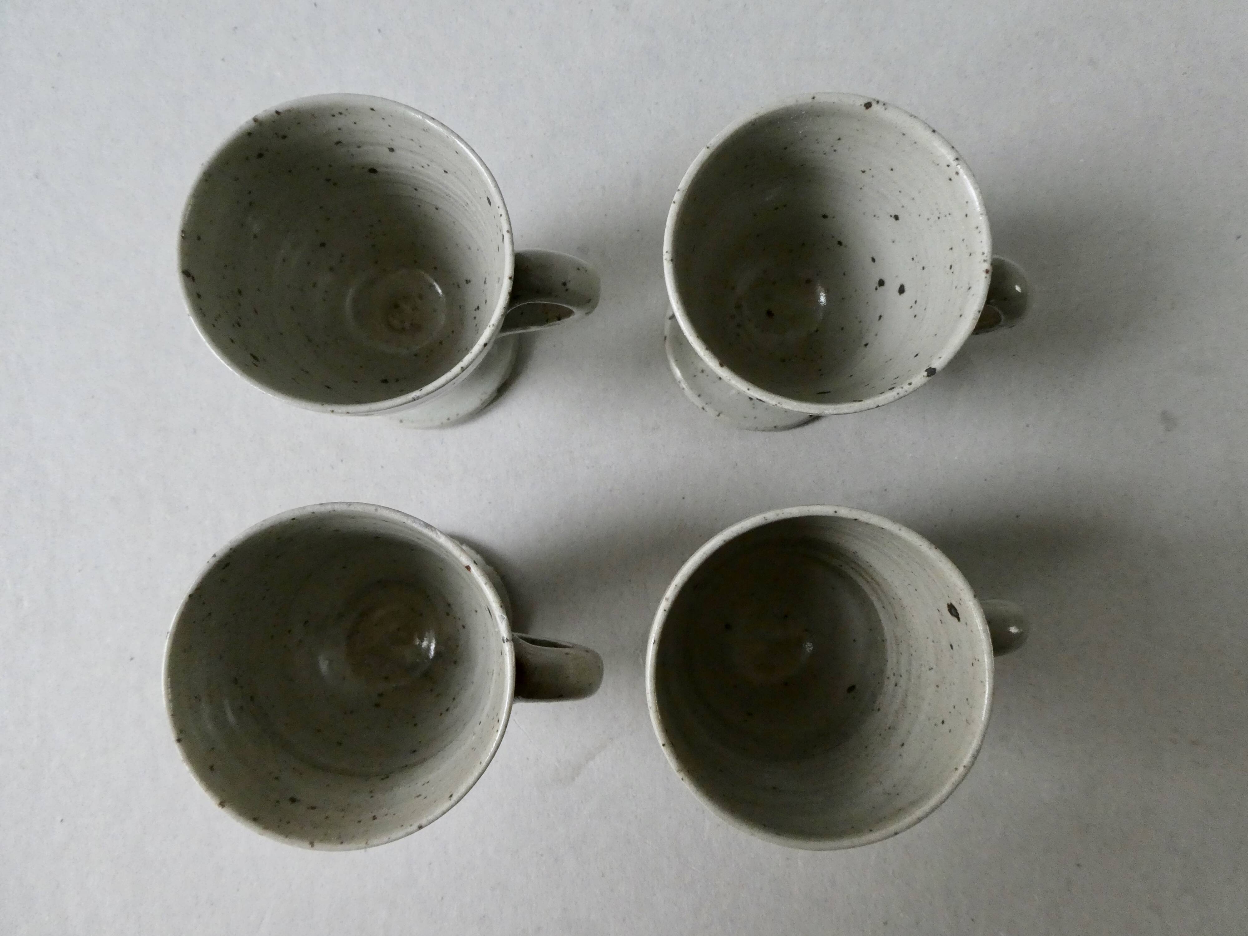 Set of 4 cups, 1 mazagran, 1 milk pot and 1 sugar bowl in pyrity sandstone, signed