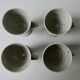 Set of 4 cups, 1 mazagran, 1 milk pot and 1 sugar bowl in pyrity sandstone, signed