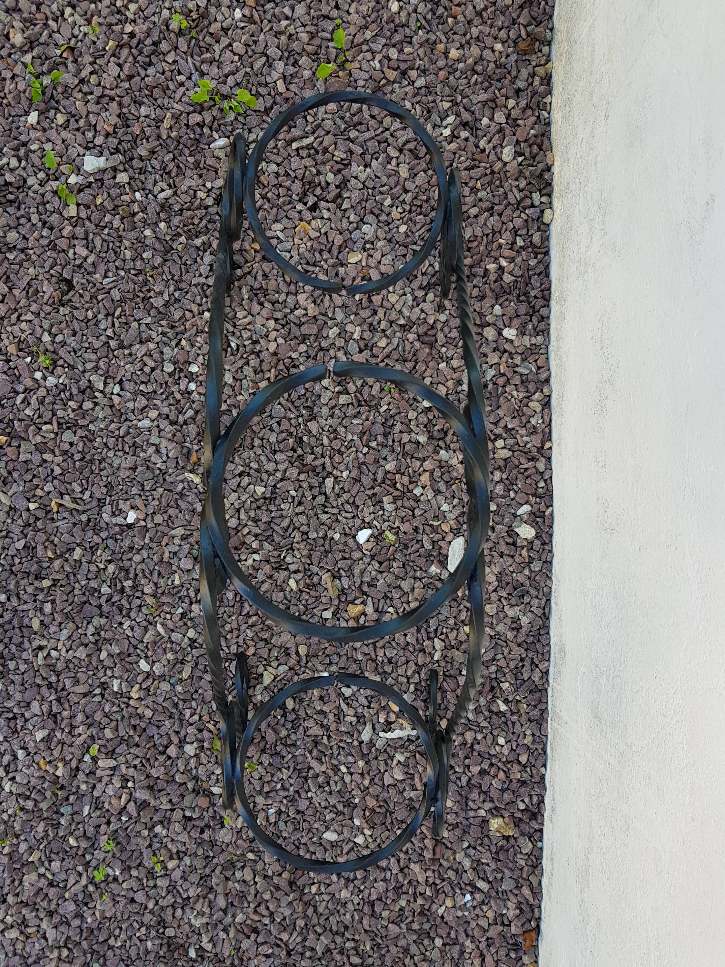Black wrought iron plant holder