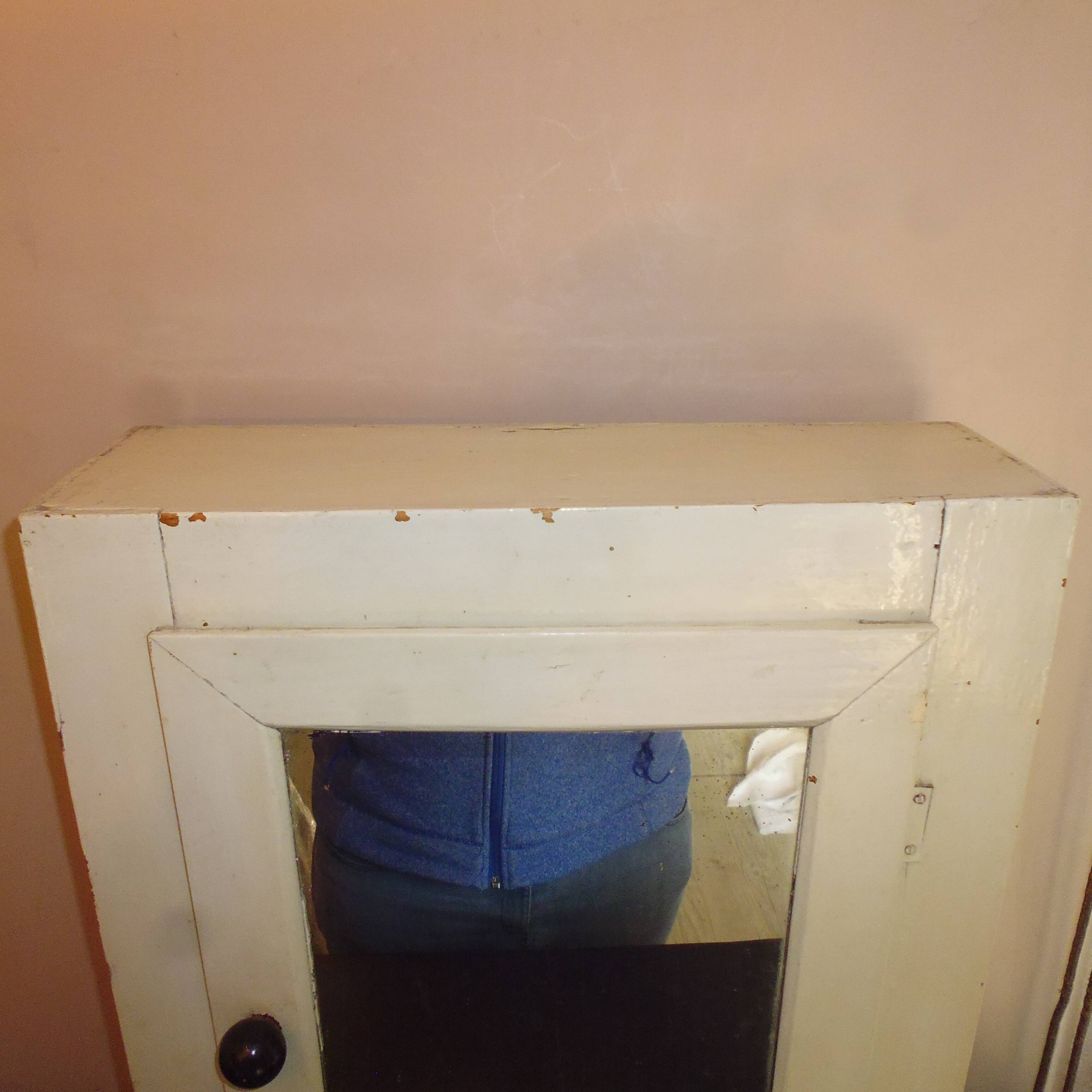 Former wooden medicine cabinet and mirror