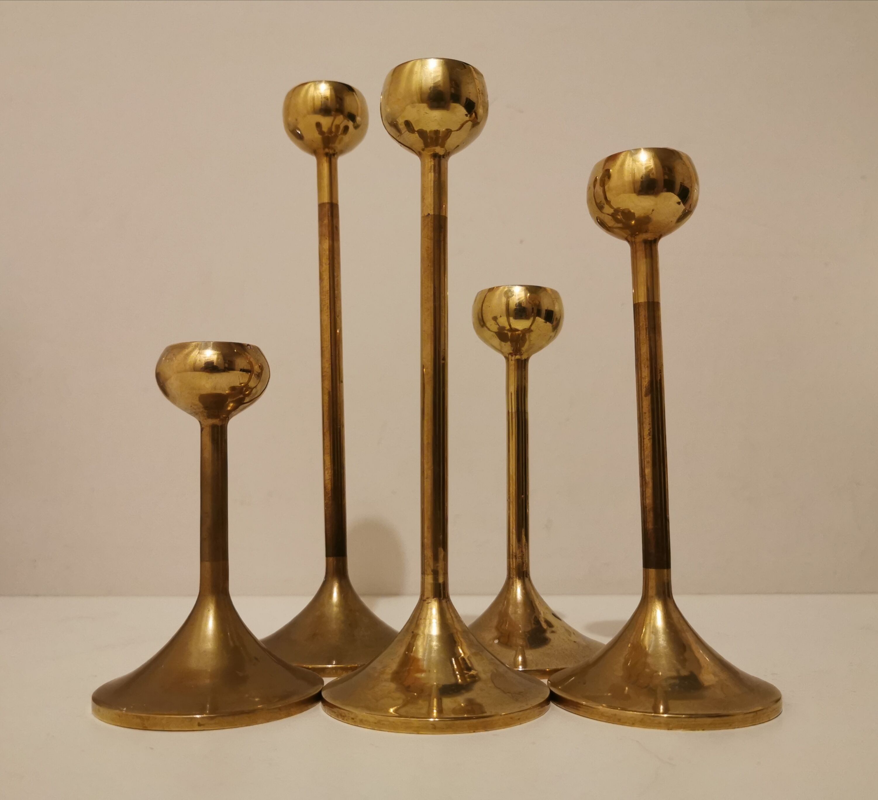 Set of 5 brass candlesticks from the 70s