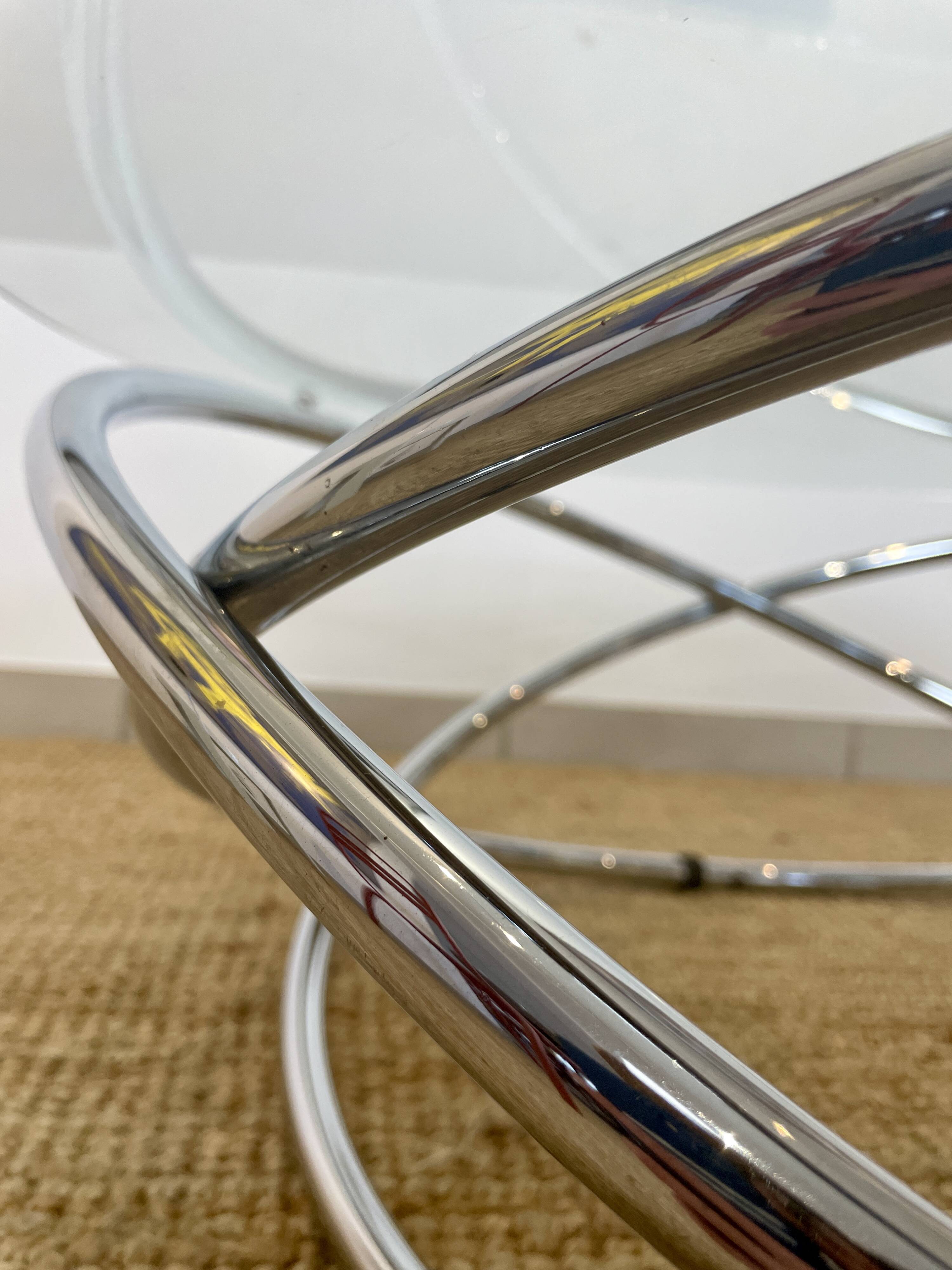 Coffee table with glass top and chrome tubular base