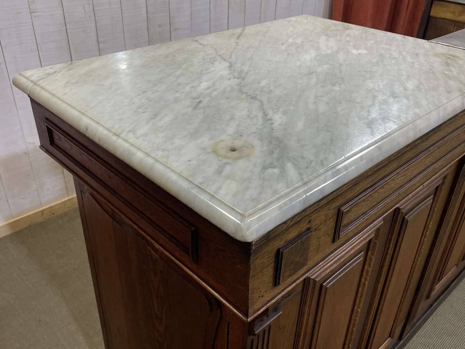 Bar counter in oak, zinc, and white marble from the early 20th century.