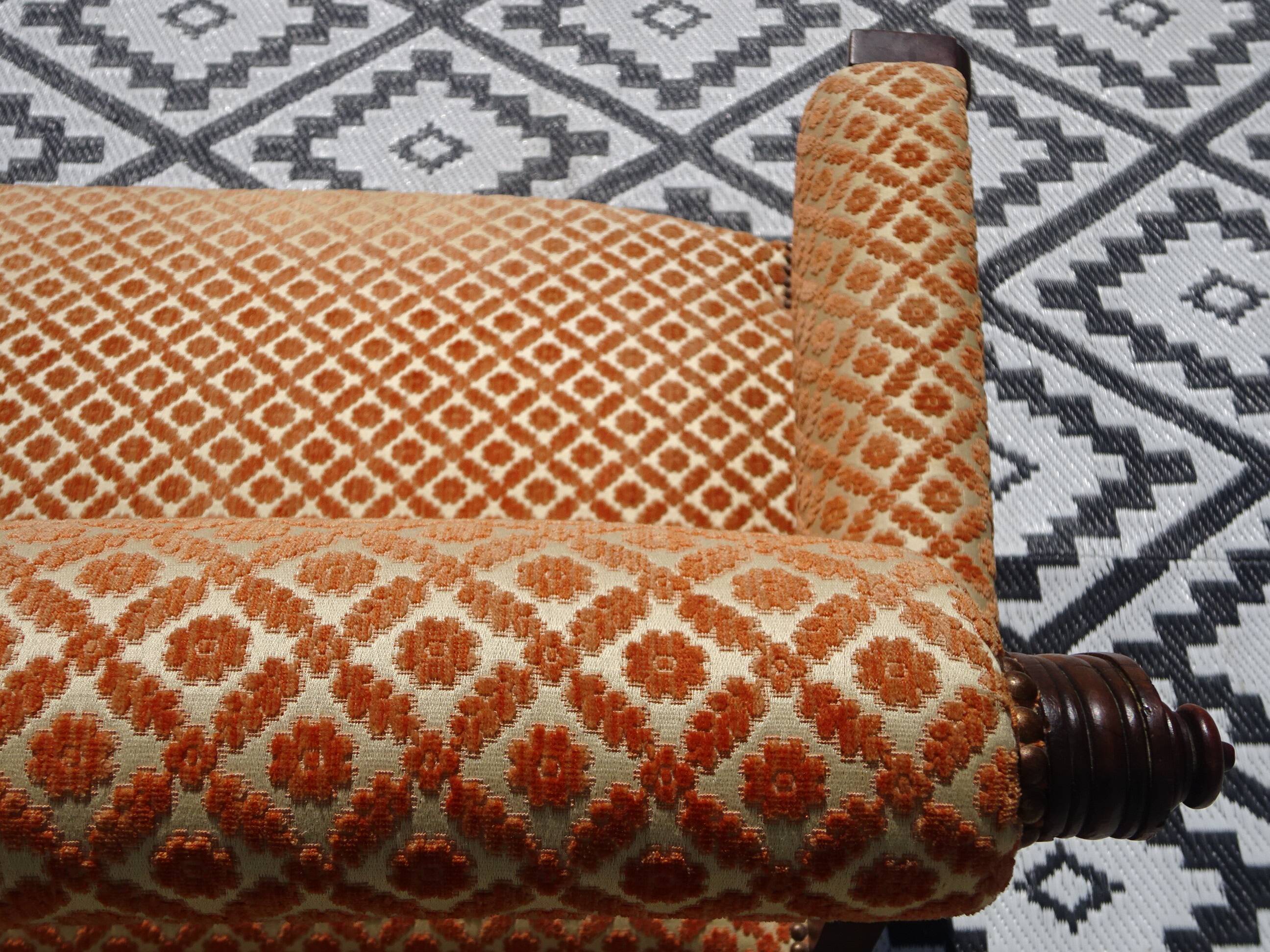 Old wooden and velvet bench