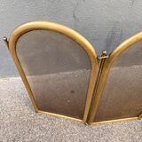 Antique brass fireplace screen from 1920, vintage spark guard.