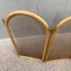Antique brass fireplace screen from 1920, vintage spark guard.