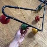 Vintage coat rack in the style of Roger Ferraud.