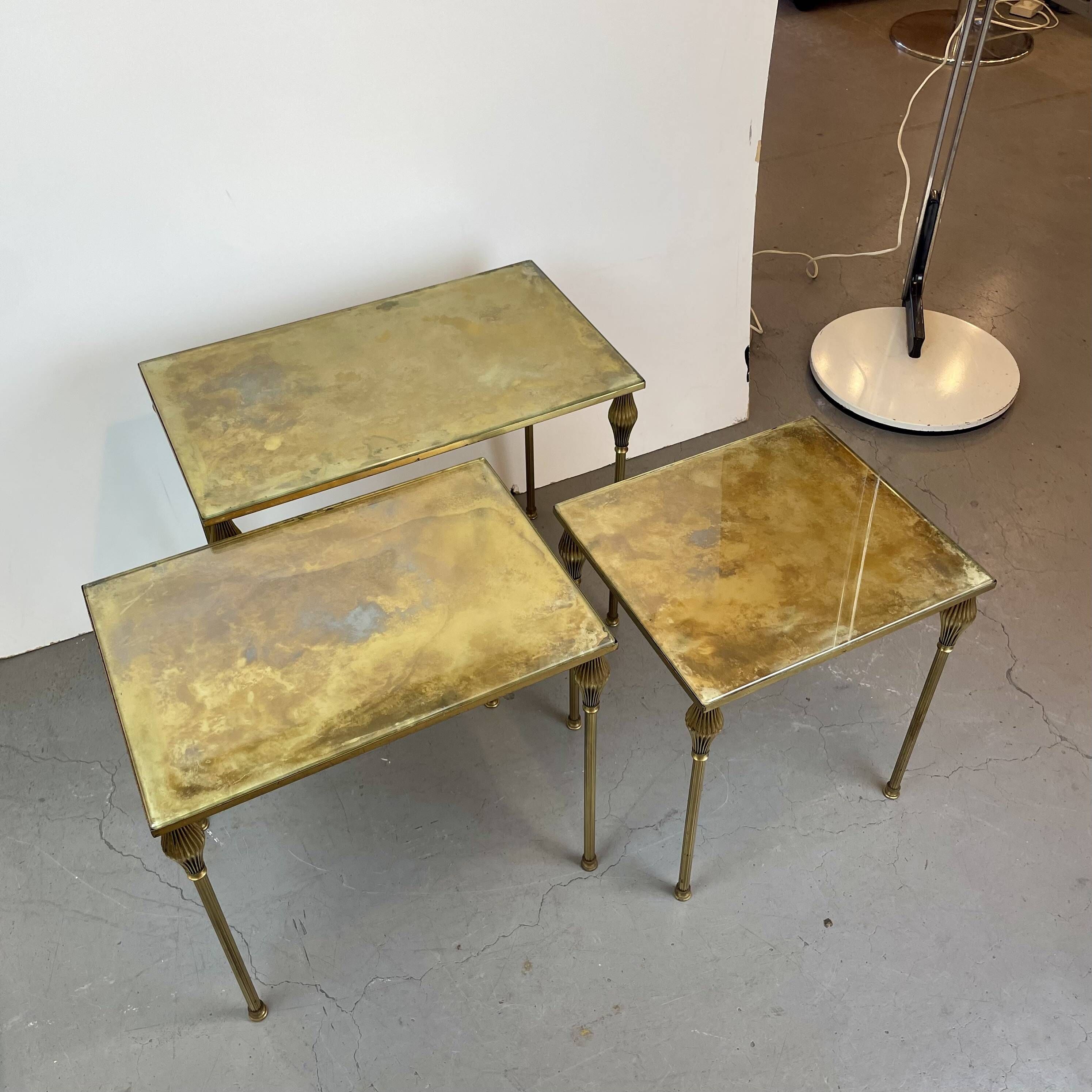 Nested brass tables, attributed to Maison Baguès, France, 1950–60.