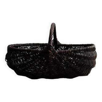 Dark wicker basket, mushroom basket.