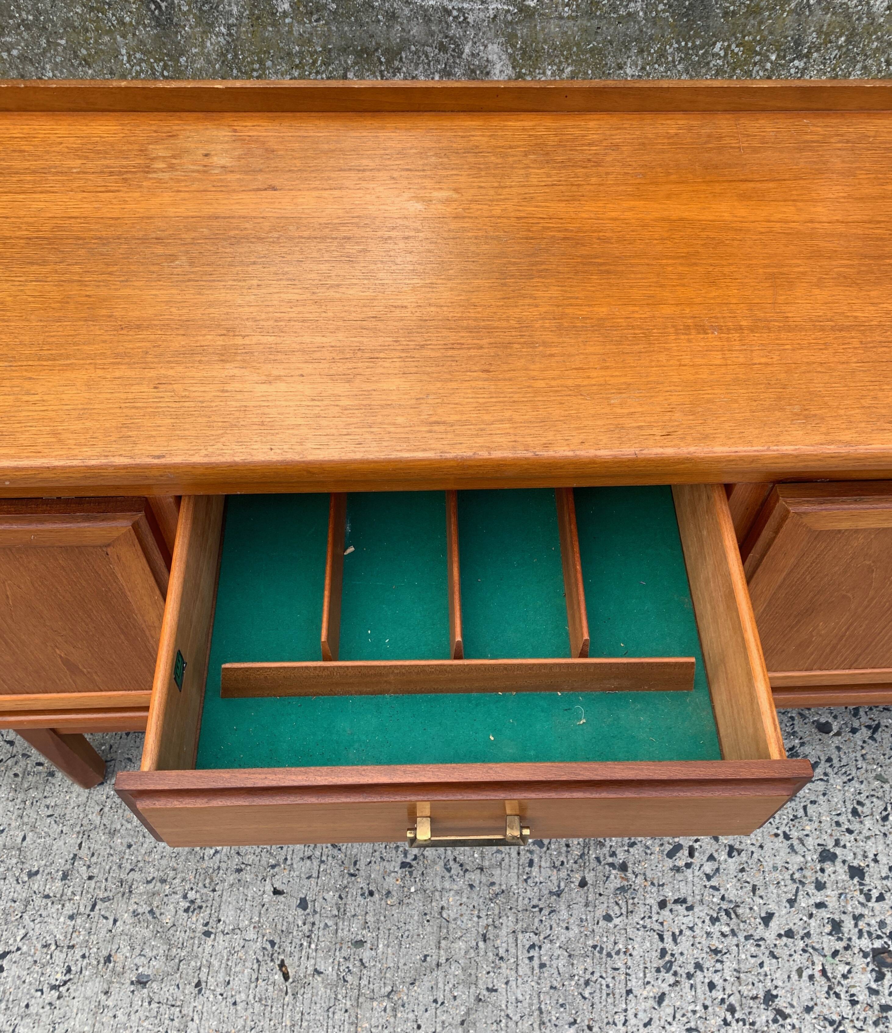 Teak enfilade from the 1970s by the English brand William Laurence.