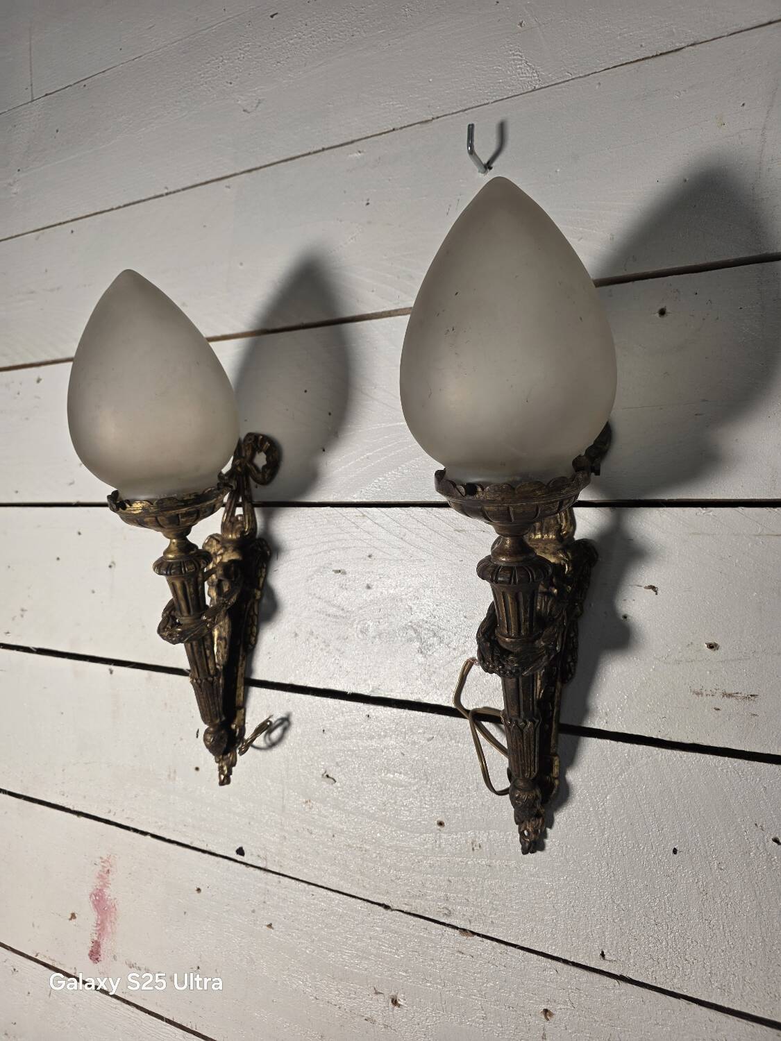 Pair of torch wall lights in Louis XVI style in 19th-century bronze.