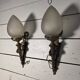 Pair of torch wall lights in Louis XVI style in 19th-century bronze.