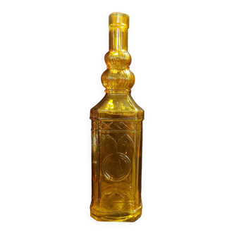 Yellow molded glass bottle early 20th century