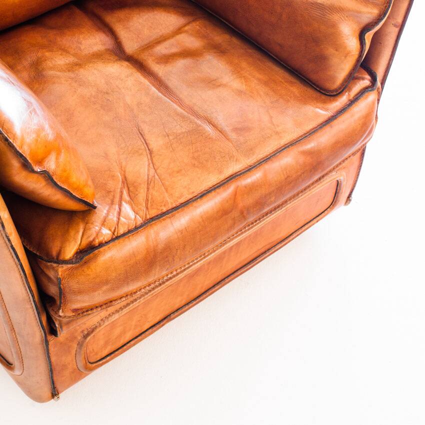 Vintage club armchair by Roche Bobois. Camel buffalo leather. France, 1980s.
