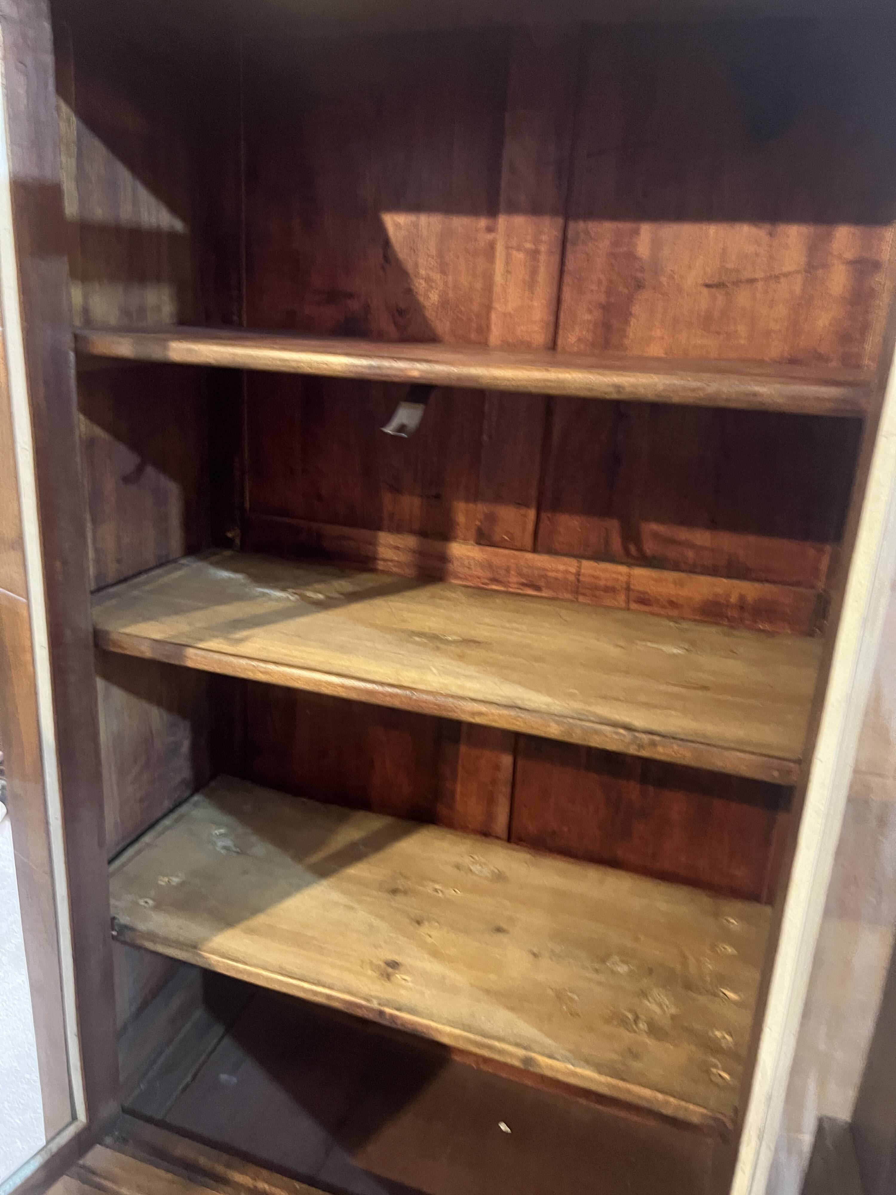 Two-door display cabinet in Louis Philippe style.