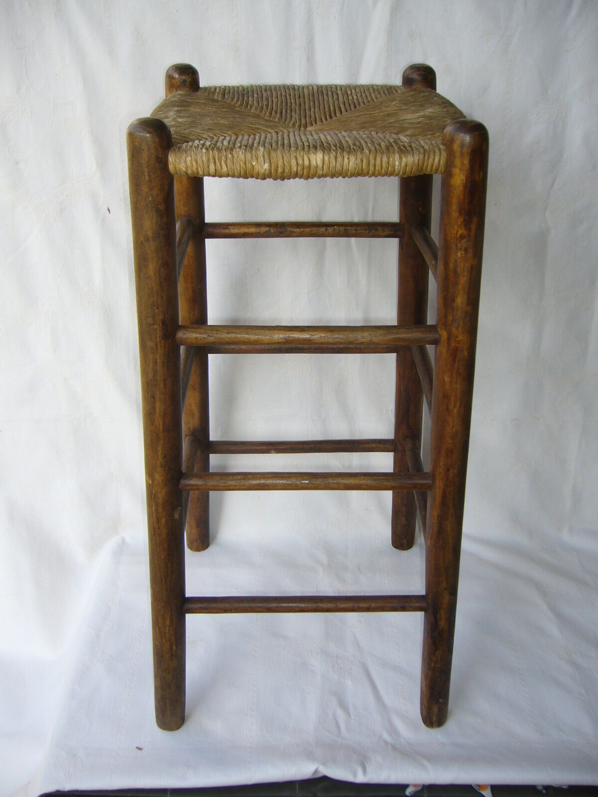 Ancient wooden and straw stool