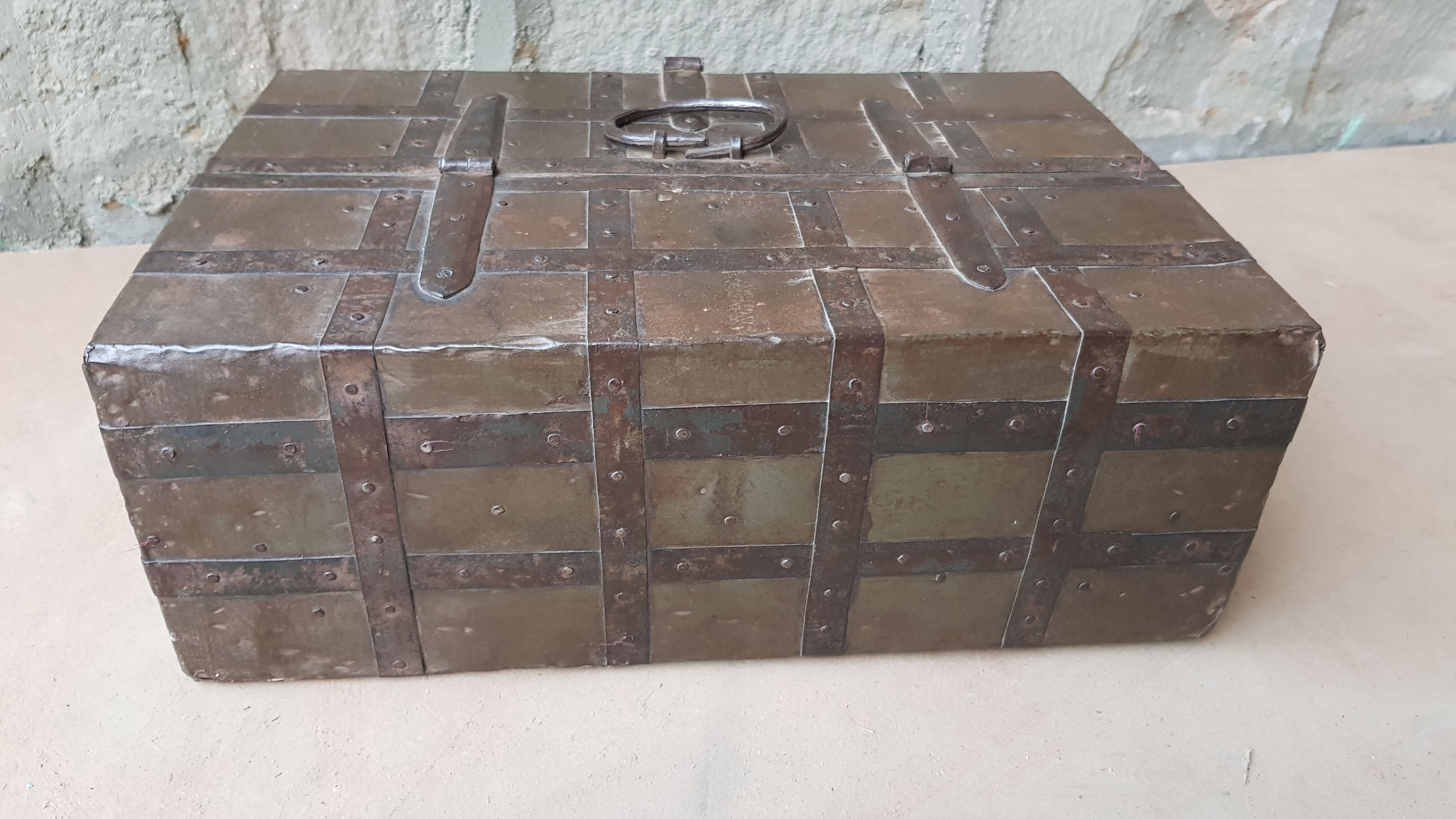 Old tribal chest in hammered metal
