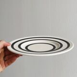 Ceramic plate with black round patterns