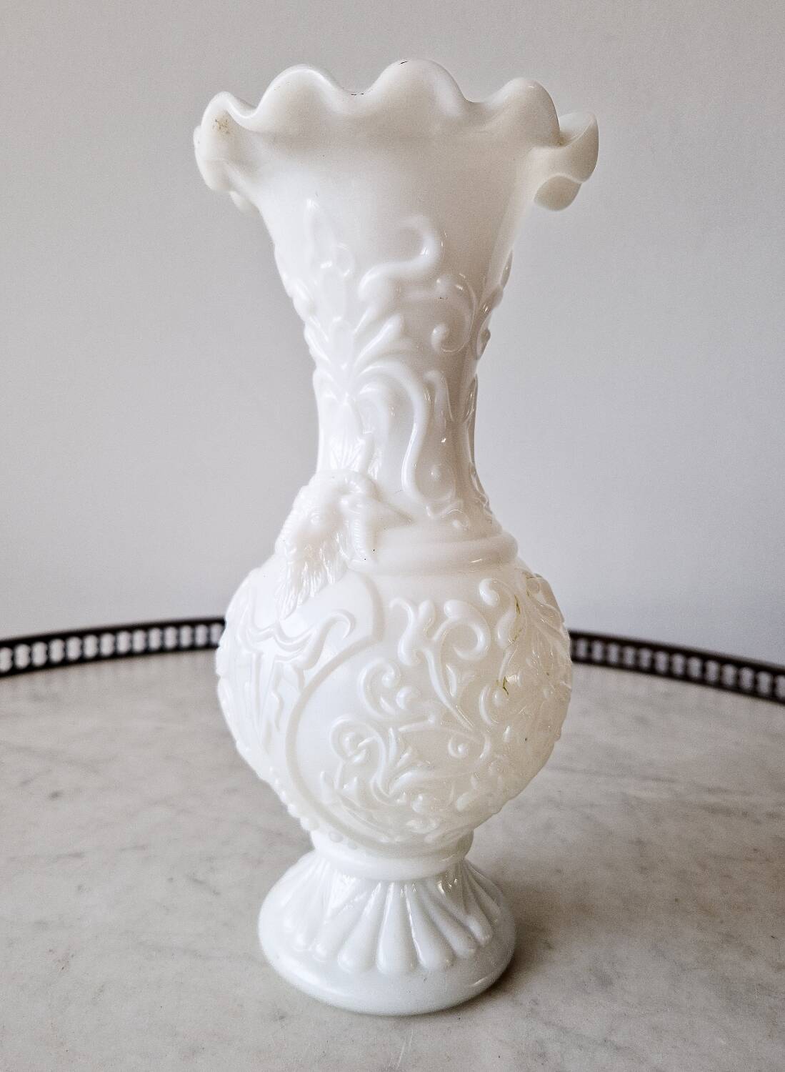 White opaline vase decorated with arabesques and ram's heads