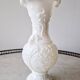White opaline vase decorated with arabesques and ram's heads