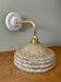 Vintage glass wall lamp with yellow Clichy shade and silver trim.