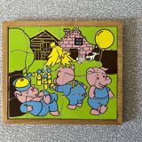 Wooden puzzle frame from the 50s/60s representing the 3 little pigs.