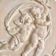 Pair of putti medallions