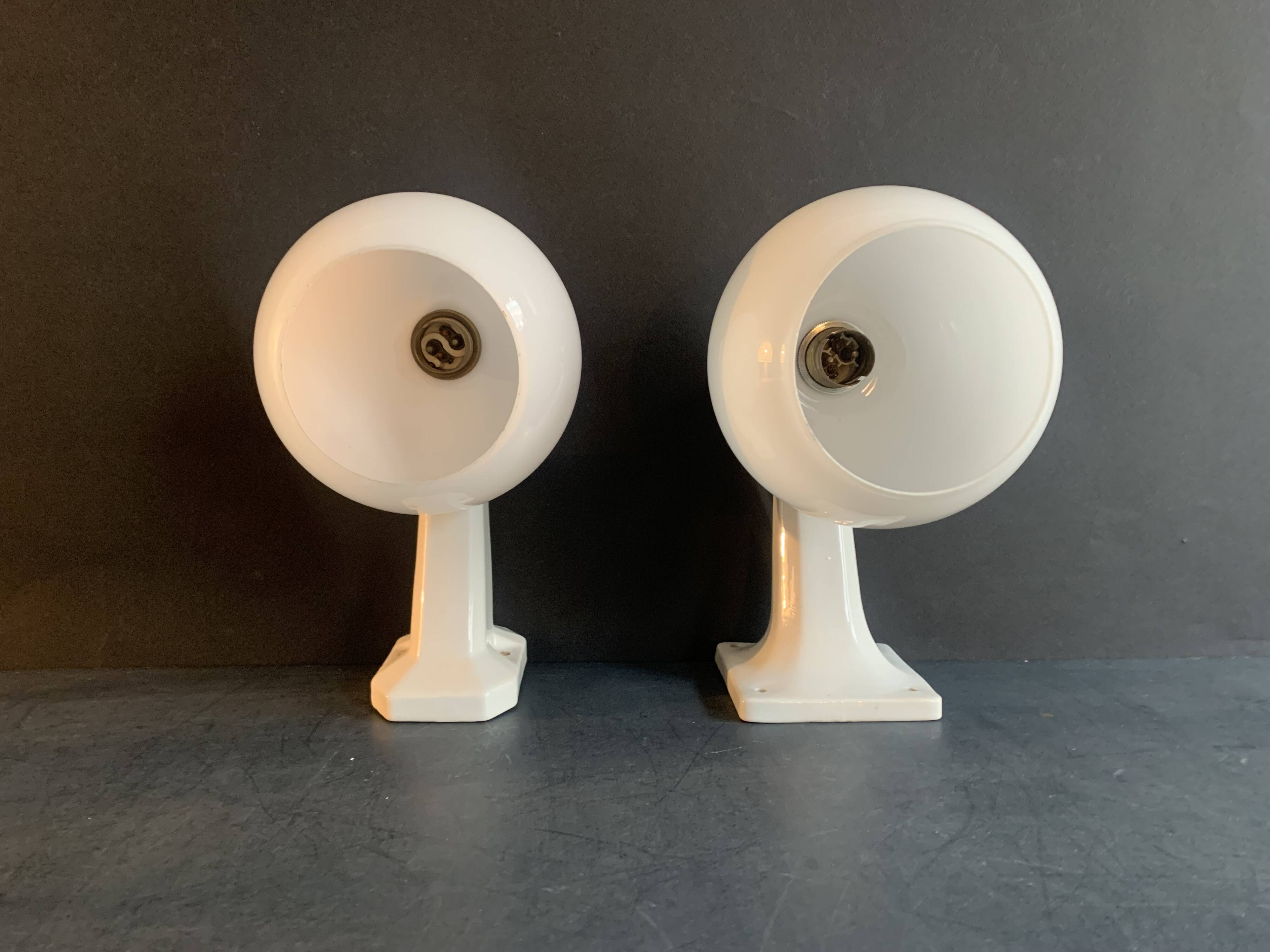 Pair of Art Deco porcelain wall lights with white Opaline globes, 1920