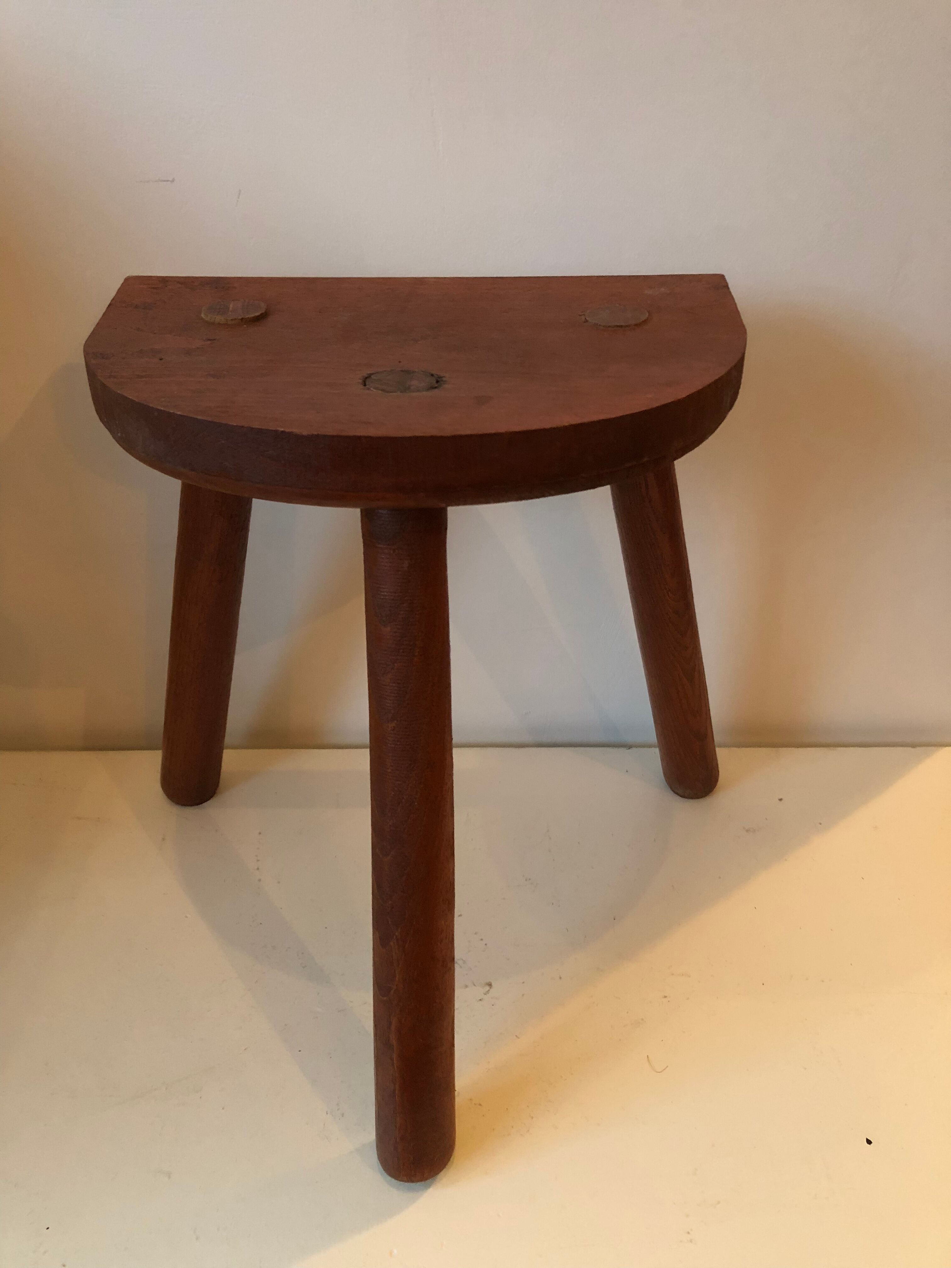 Old wooden tripod stool