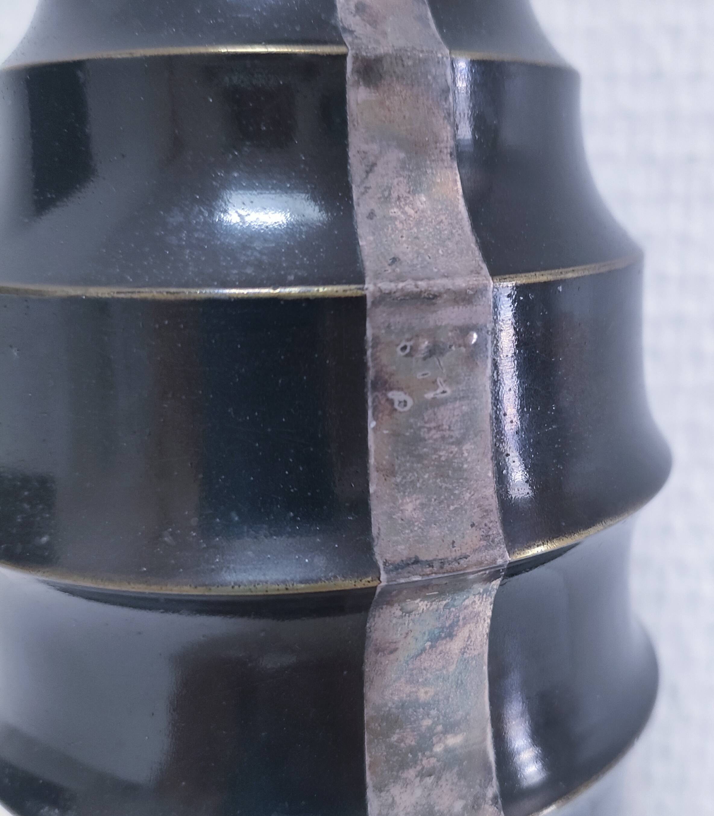 Art Deco metal lamp base with black and silver patina