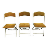 Three folding opera chairs in old gold velvet and brass structure