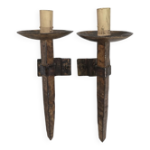 Pair of brutalist wall sconces in hammered and patinated iron, work from the years.