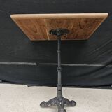 Bistro table with cast iron base and teak top