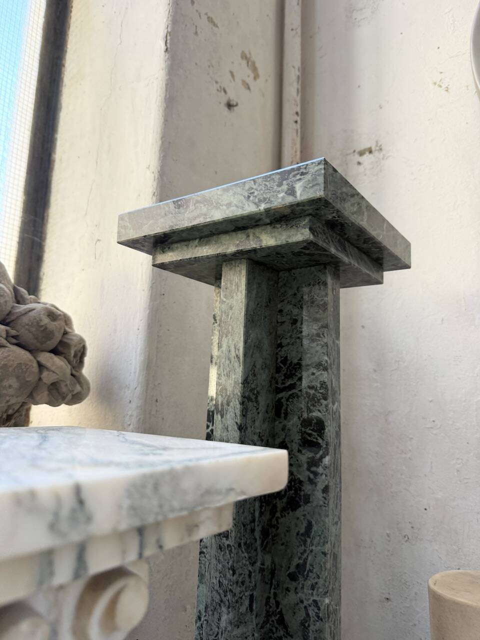 Set of 4 marble columns or pedestals.