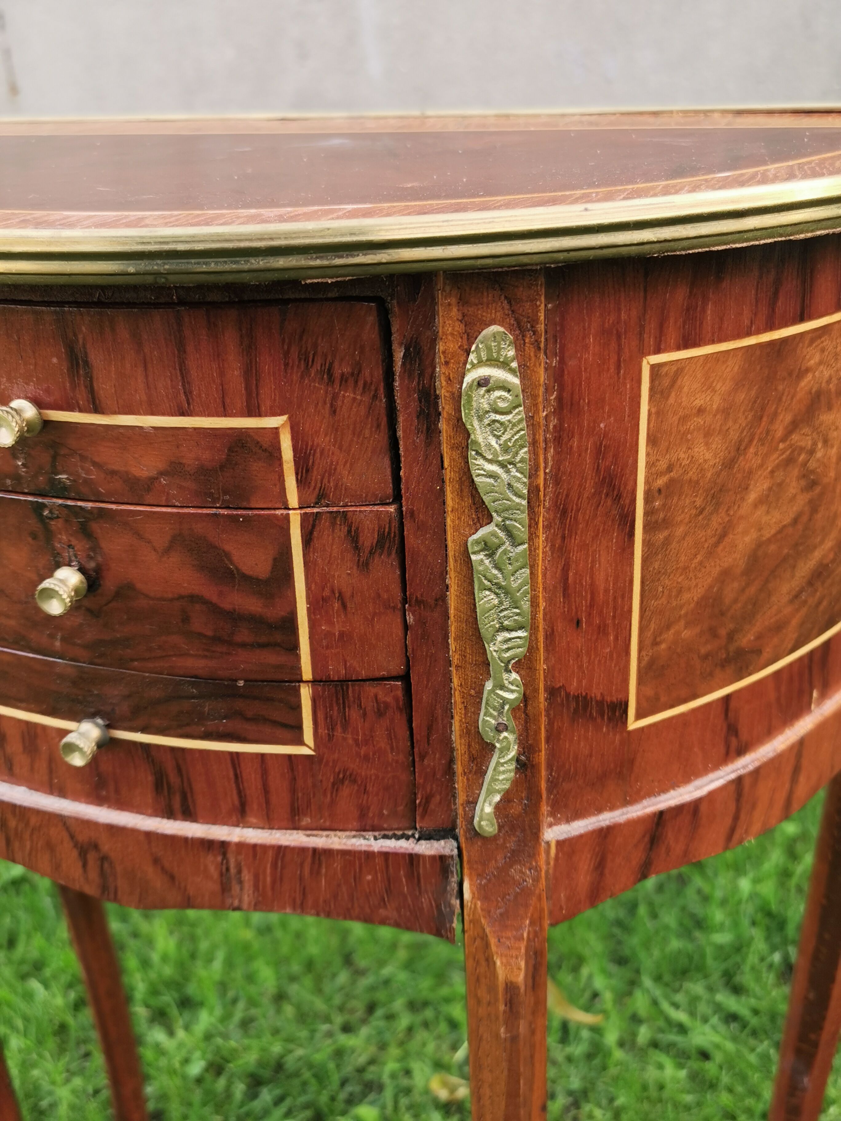 half-moon bedside pair in marquetry, bronze ornaments