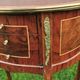 half-moon bedside pair in marquetry, bronze ornaments