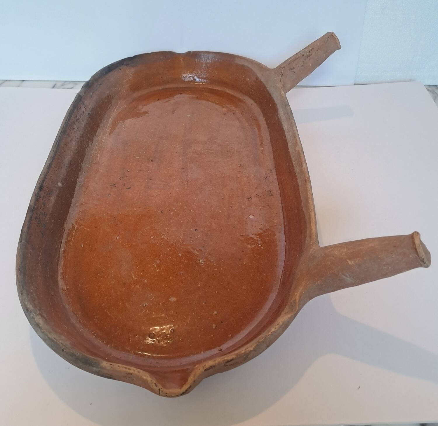 Old glazed terracotta frying pan from the 19th century.