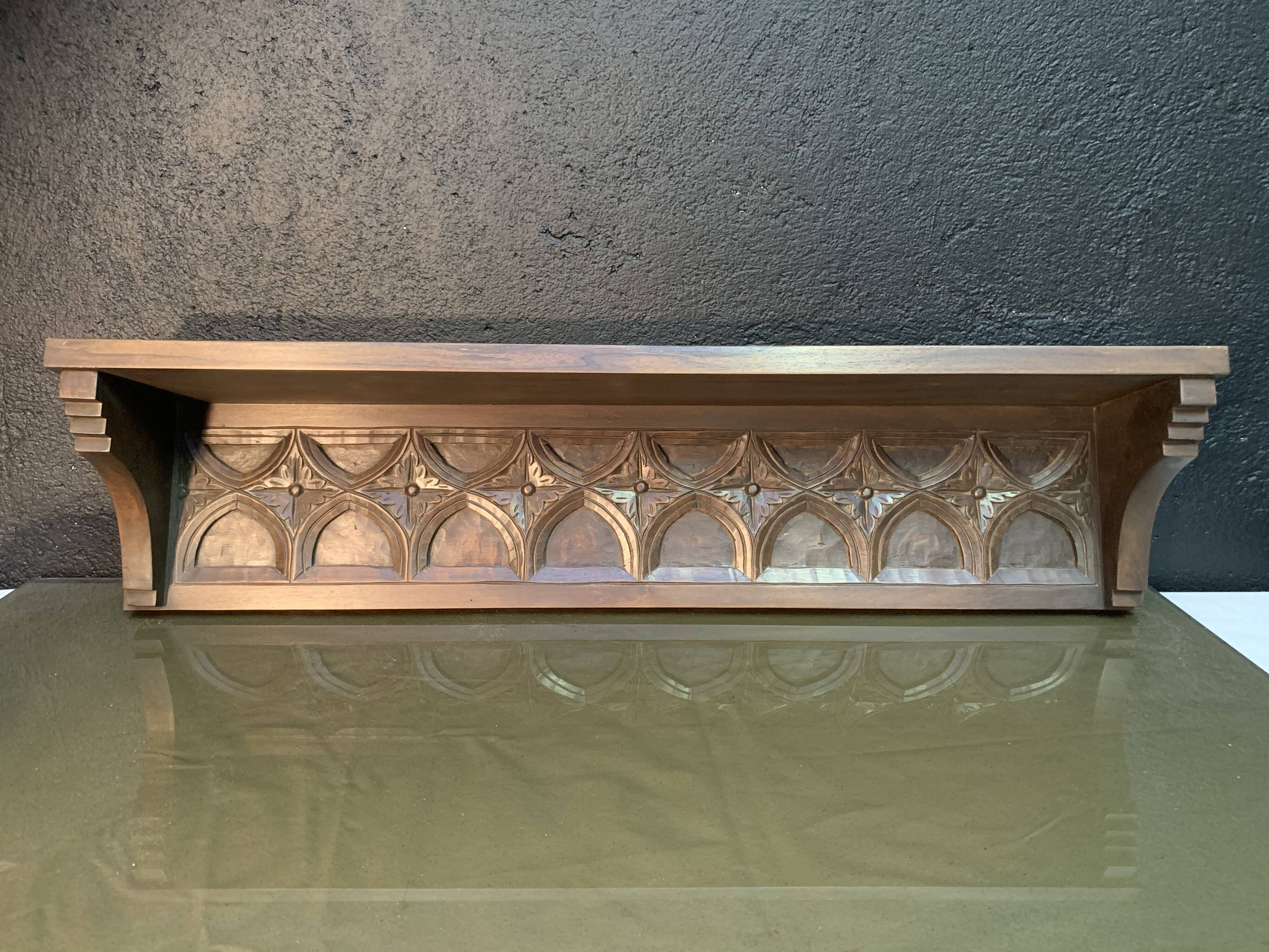 Carved wooden wall shelf
