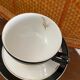 5 coffee cups in white, gold and black