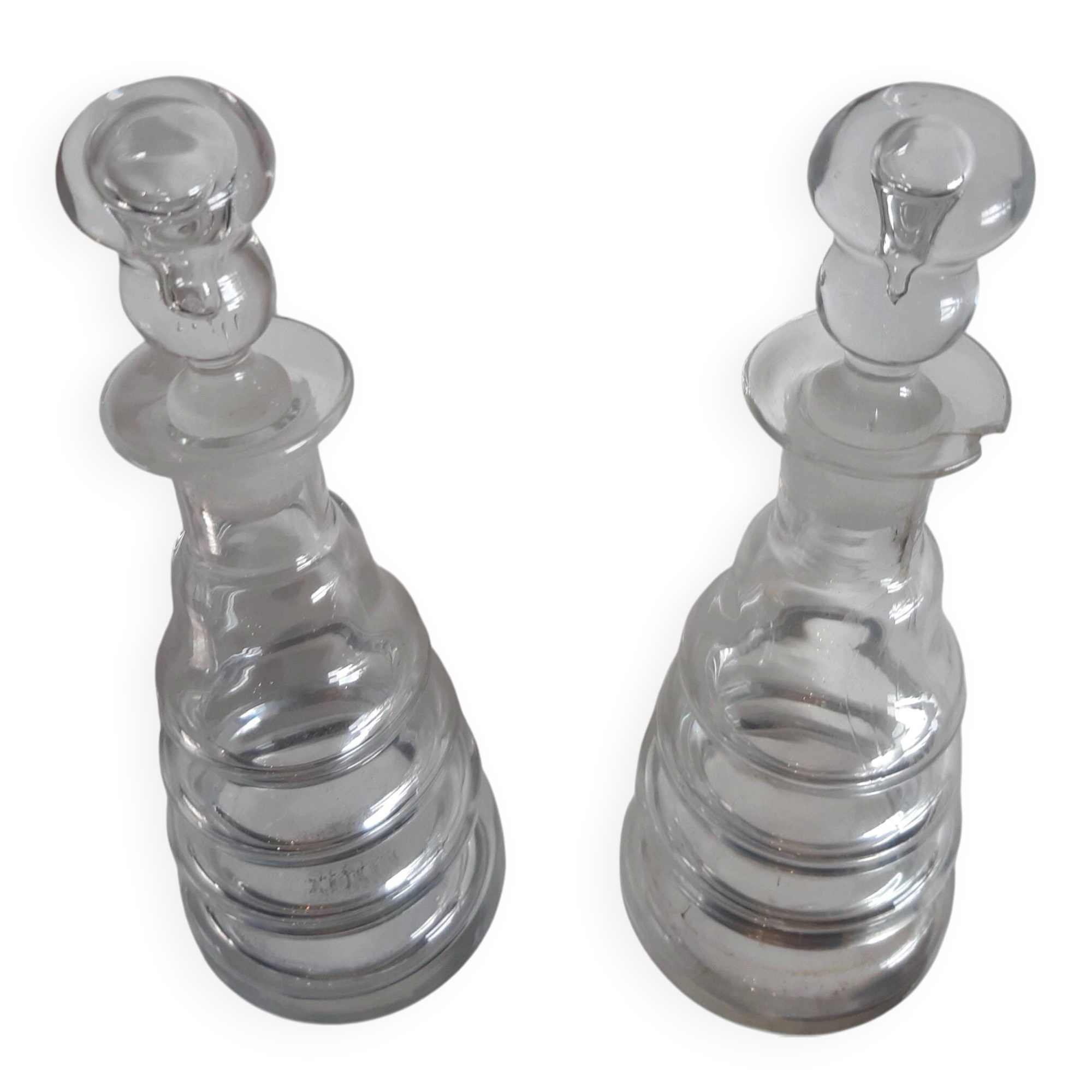 Set of two oil and vinegar glass cruets.
