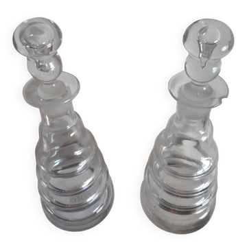 Set of two oil and vinegar glass cruets.