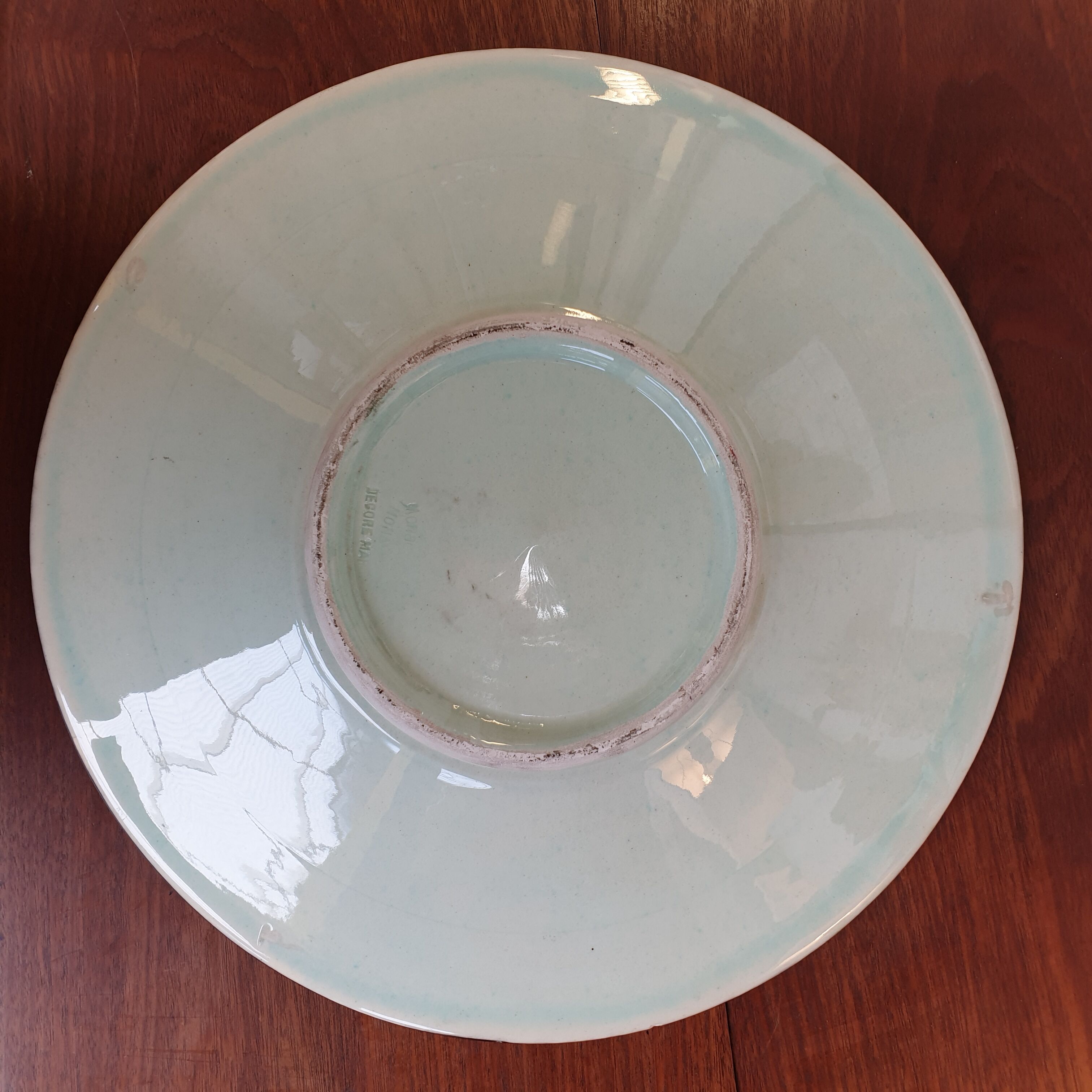 Ceramic dish nu feminine on black background