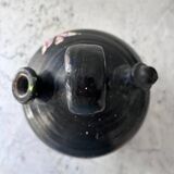 Black water jug with floral decoration