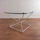 Glass coffee table with steel base