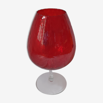 Red glass vase with blown glass foot