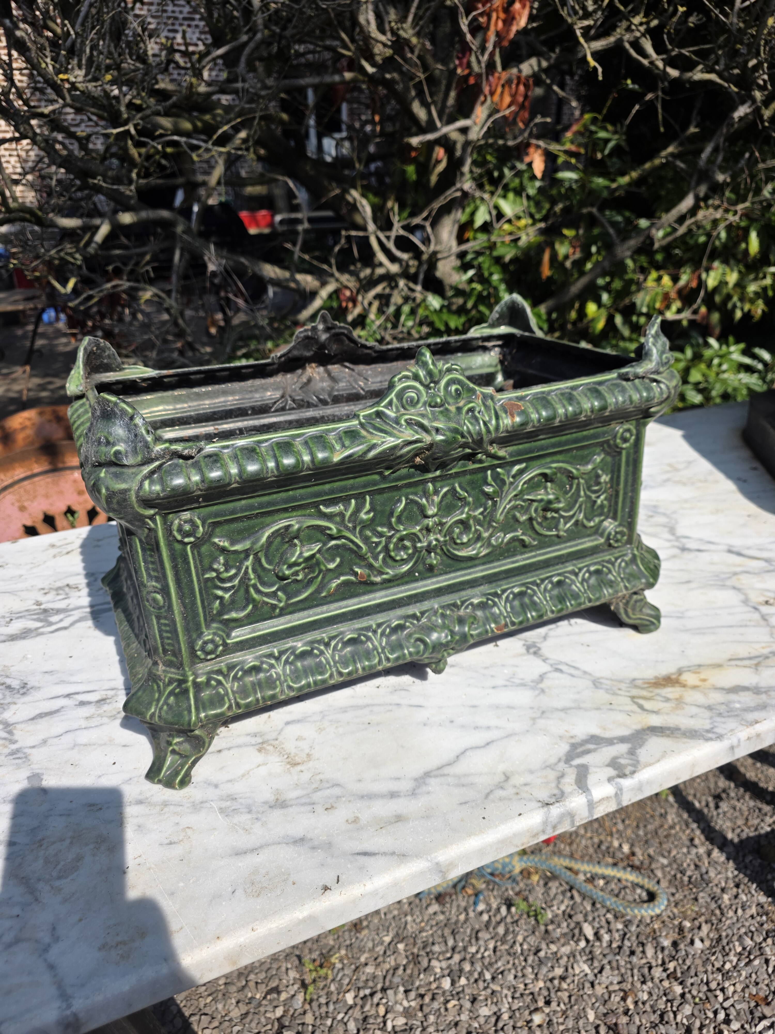 Antique enamelled cast iron planter in the Napoleon III style.