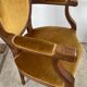 Paire de fauteuils médaillon en bois et velours