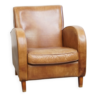 Fauteuil design en cuir de vachette couleur cognac clair