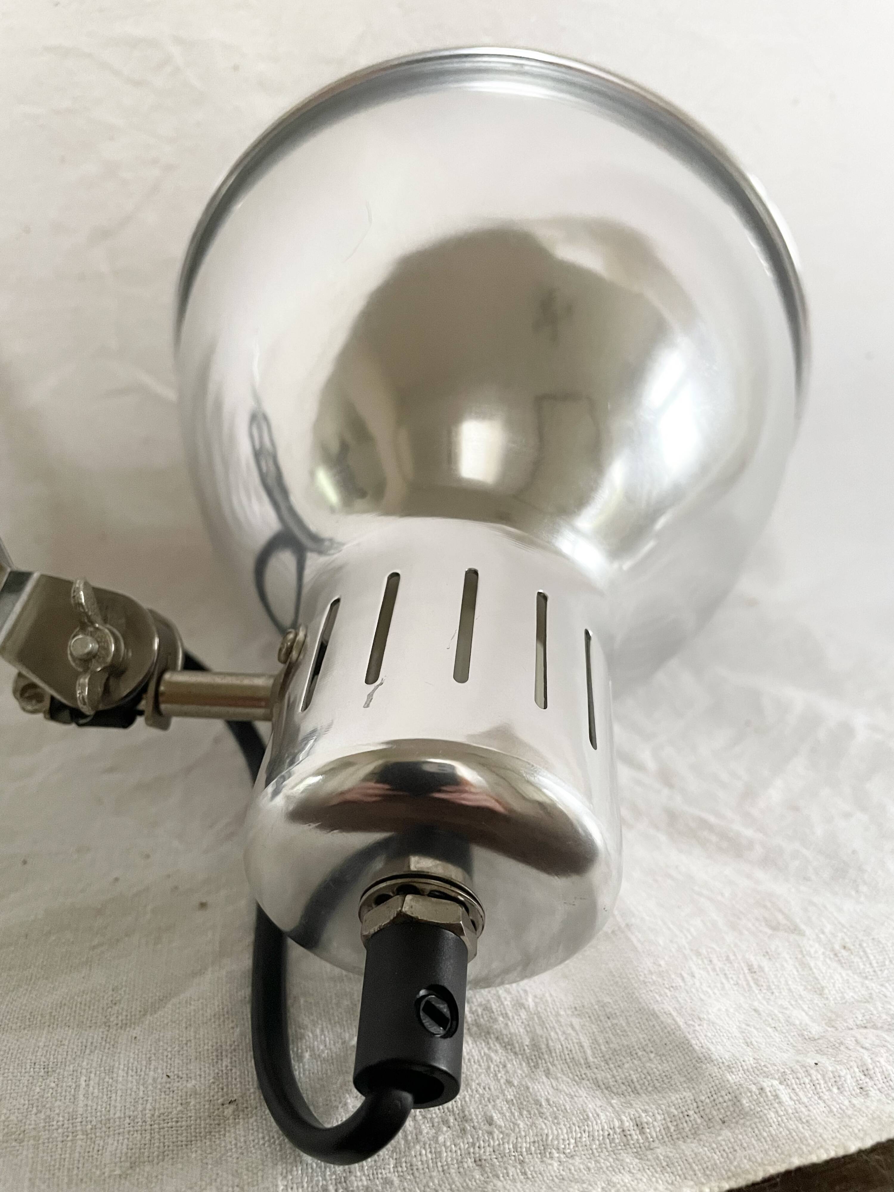 Vintage accordion wall light in chrome metal.