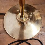 Bronze floor lamp with pine cone decoration.